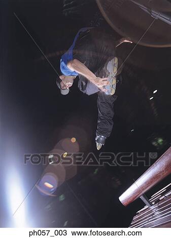 In-line skater in mid-jump View Large Photo Image Stock Image - In-line skater in mid-jump . Fotosearch