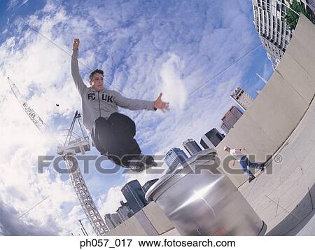 In-line skater in mid-jump View Large Photo Image Stock Photo - In-line skater in mid-jump . Fotosearch