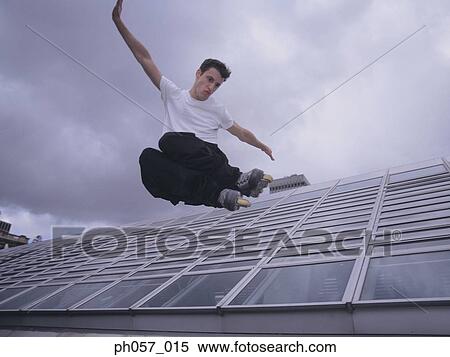 Stock Photography - In-line skater in mid-jump . Fotosearch