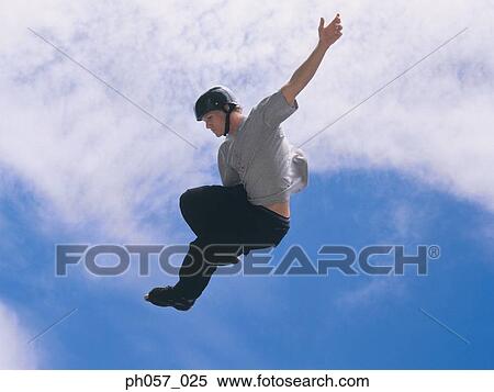 Stock Photography - In-line skater in mid-jump . Fotosearch