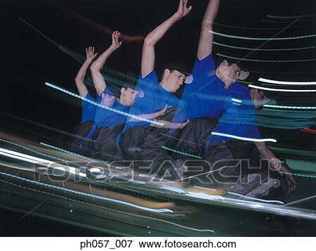 In-line skater performing stunt on railing, multiple exposure View Large Photo Image Stock Photo - In-line skater performing stunt on railing, multiple exposure. Fotosearch