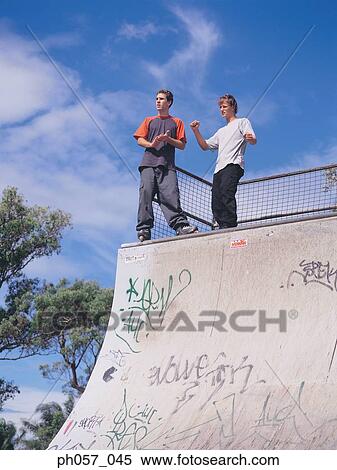 In-line skaters standing on ramp View Large Photo Image Stock Photography - In-line skaters standing on ramp. Fotosearch