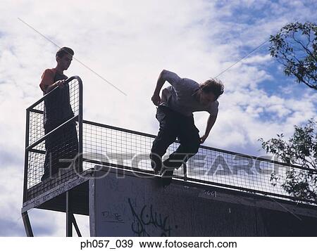 In-line skating jumping off ramp, low-angle view View Large Photo Image Stock Photo - In-line skating jumping off ramp, low-angle view . Fotosearch