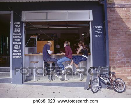 Stock Image - Friends at sidewalk café. Fotosearch