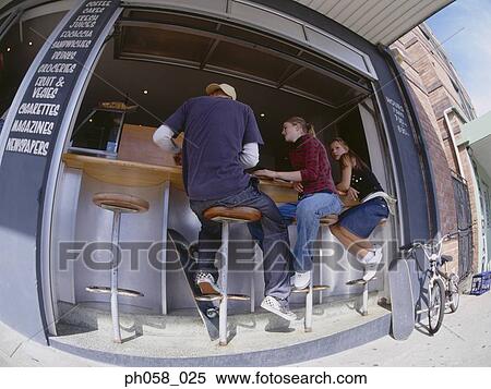 Stock Photography - Friends at sidewalk café. Fotosearch