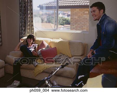 Couple sitting in the room View Large Photo Image Picture - Couple sitting in the room. Fotosearch