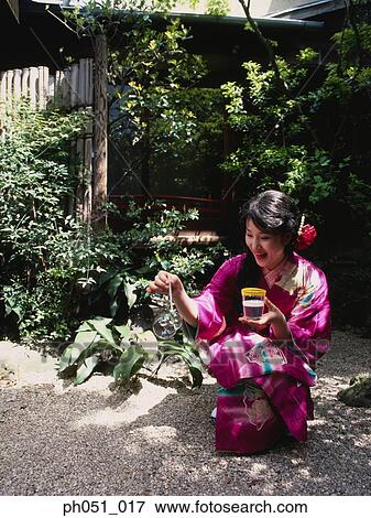 Japanese woman in kimono blowing bubbles View Large Photo Image Stock Photo - Japanese woman in kimono blowing bubbles. Fotosearch