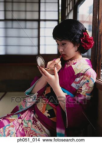 Picture - Japanese woman in kimono, wearing lipstick. Fotosearch