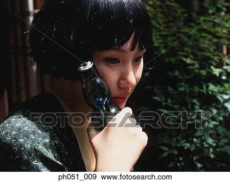 Woman holding a bottle, portrait View Large Photo Image Stock Photo - Woman holding a bottle, portrait. Fotosearch