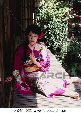 Woman in Japanese garden, portrait View Large Photo Image Stock Image - Woman in Japanese garden, portrait. Fotosearch