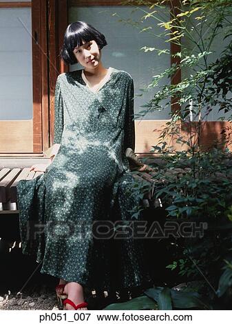 Woman in Japanese garden View Large Photo Image Stock Photo - Woman in Japanese garden. Fotosearch