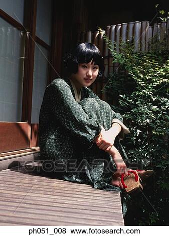 Woman in Japanese garden View Large Photo Image Stock Photo - Woman in Japanese garden. Fotosearch
