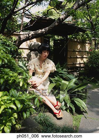 Woman in Japanese garden View Large Photo Image Stock Photograph - Woman in Japanese garden. Fotosearch