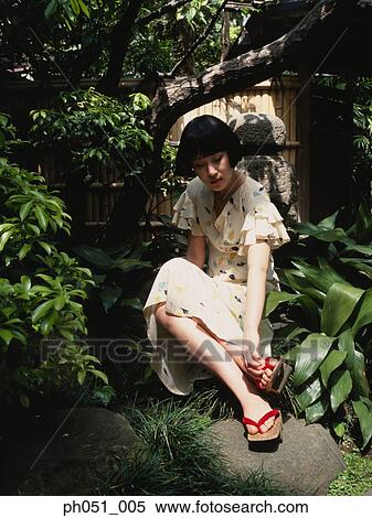 Woman in Japanese garden View Large Photo Image Stock Photography - Woman in Japanese garden. Fotosearch