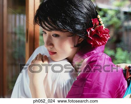 Japanese couple embracing in garden View Large Photo Image Picture - Japanese couple embracing in garden. Fotosearch