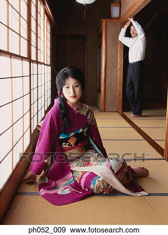 Stock Photo - Japanese woman and man (focus on Japanese woman in kimono). Fotosearch