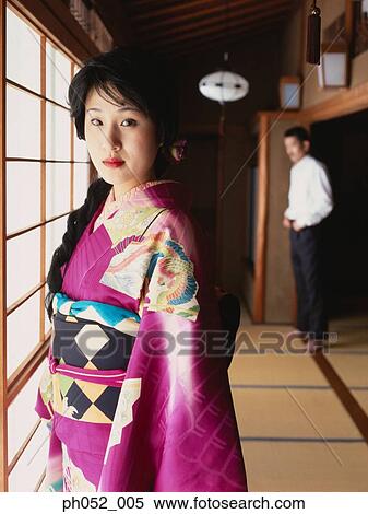 Stock Photography - Japanese woman and man (focus on Japanese woman in kimono). Fotosearch