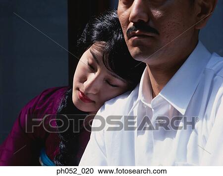 Japanese woman leaning on man's shoulder View Large Photo Image Stock Image - Japanese woman leaning on man's shoulder . Fotosearch