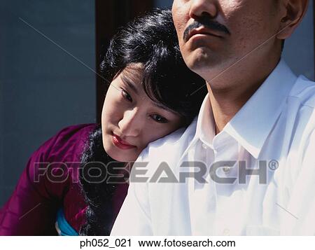 Japanese woman leaning on man's shoulder View Large Photo Image Stock Image - Japanese woman leaning on man's shoulder . Fotosearch