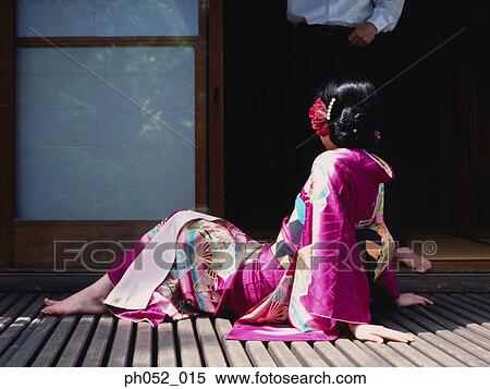Stock Photography - Traditional Japanese couple by the door. Fotosearch