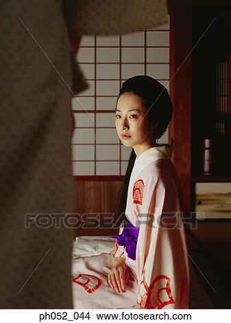 Traditional Japanese couple, indoor View Large Photo Image Picture - Traditional Japanese couple, indoor . Fotosearch