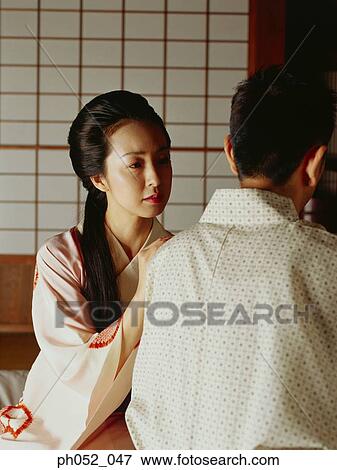 Stock Photo - Traditional Japanese couple, indoors. Fotosearch