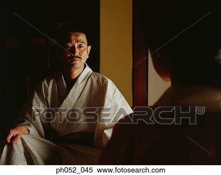 Traditional Japanese couple, view over woman's shoulder View Large Photo Image Stock Photography - Traditional Japanese couple, view over woman's shoulder . Fotosearch