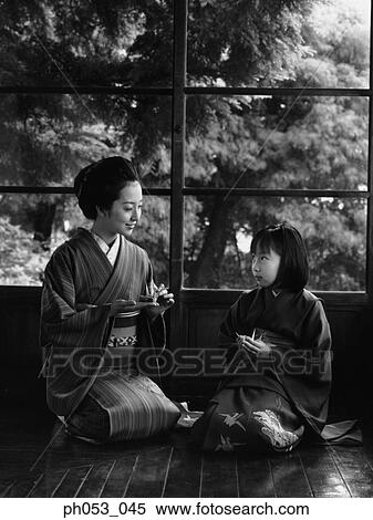 Stock Photography - Mother and daughter in kimono. Fotosearch