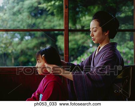 Mother combing for daughter, both in kimono View Large Photo Image Stock Image - Mother combing for daughter, both in kimono. Fotosearch