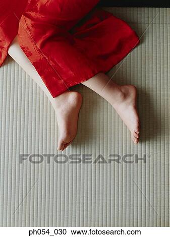 Stock Image - Close-up of a woman's legs. Fotosearch