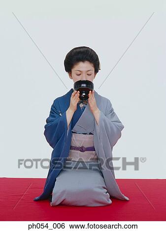 Japanese woman in kimono drinking from bowl View Large Photo Image Stock Photograph - Japanese woman in kimono drinking from bowl. Fotosearch