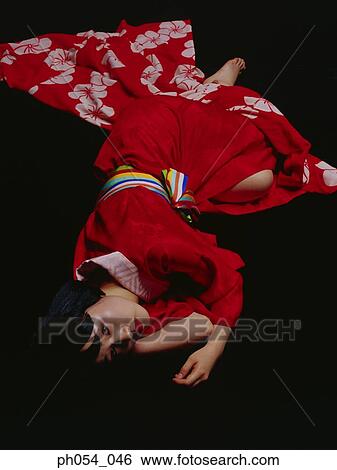Japanese woman in kimono lying on floor View Large Photo Image Stock Photograph - Japanese woman in kimono lying on floor. Fotosearch