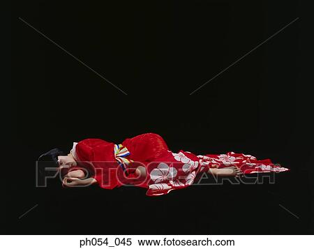 Japanese woman in kimono lying on floor View Large Photo Image Stock Photography - Japanese woman in kimono lying on floor. Fotosearch