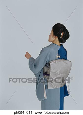 Japanese woman in kimono, rear view View Large Photo Image Stock Image - Japanese woman in kimono, rear view . Fotosearch