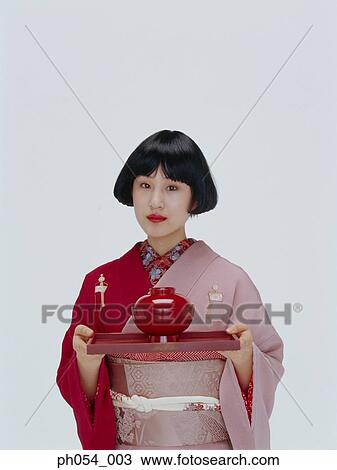 Japanese woman in kimono serving tray a bowl of soup View Large Photo Image Stock Image - Japanese woman in kimono serving tray a bowl of soup. Fotosearch