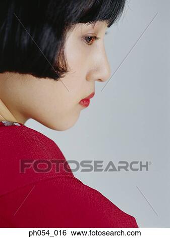 Stock Photograph - Japanese woman in kimono, side view. Fotosearch