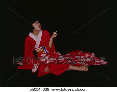 Japanese woman in kimono sitting on floor View Large Photo Image Stock Photo - Japanese woman in kimono sitting on floor. Fotosearch