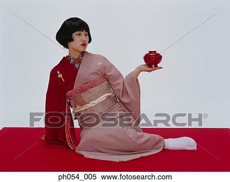 Japanese woman in kimono with bowl View Large Photo Image Stock Photography - Japanese woman in kimono with bowl. Fotosearch