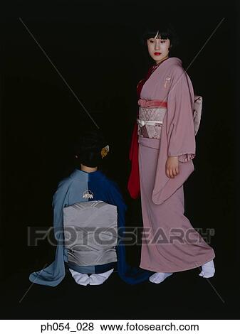 Stock Photo - Two Japanese women in traditional kimonos. Fotosearch