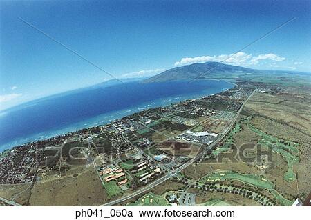 Stock Image - Aerial over land of Maui, Hawaii . Fotosearch