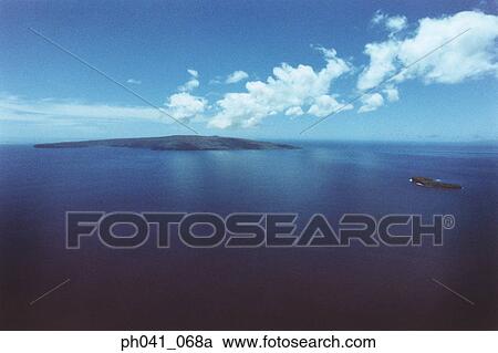 Stock Image - Scenic aerial of Molokini island; Maui, Hawaii . Fotosearch