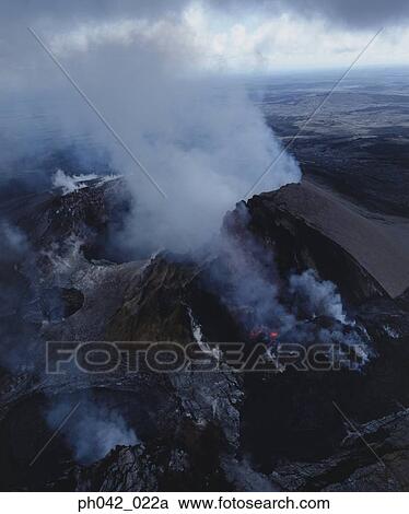 Stock Image - Lava flows cover a desolate landscape, Big Island, Hawaii. Fotosearch