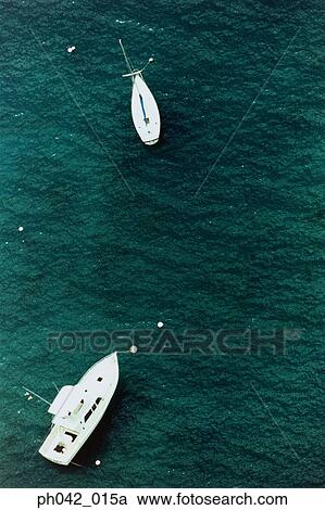 Stock Image - Motor boats on ocean, aerial view, Hawaii, USA . Fotosearch