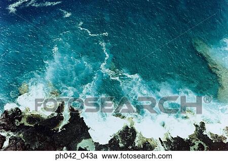 Stock Image - Waves breaking over rock, Big Island, Hawaii. Fotosearch
