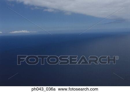 Stock Image - Ocean and clouds, Big Island, Hawaii, aerial view. Fotosearch