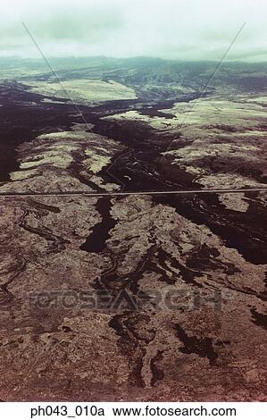 Stock Image - USA, Hawaii, Big Island, highway on lava field, aerial view . Fotosearch