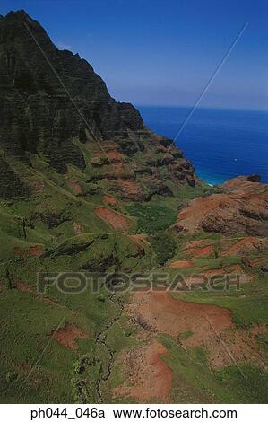 Aerial view of a mountainous cliff bordering the ocean, Kauai, Hawaii View Large Photo Image Stock Image - Aerial view of a mountainous cliff bordering the ocean, Kauai, Hawaii. Fotosearch