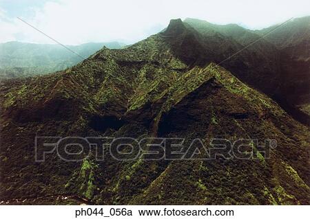 Aerial view of mountains with low lying clouds above them, Kauai, Hawaii View Large Photo Image Stock Image - Aerial view of mountains with low lying clouds above them, Kauai, Hawaii . Fotosearch