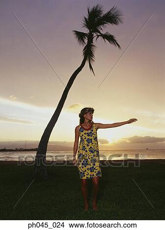 Picture - Hawaiian woman dancing at sunset . Fotosearch