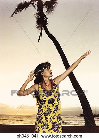 Hawaiian woman dancing at sunset View Large Photo Image Stock Image - Hawaiian woman dancing at sunset . Fotosearch